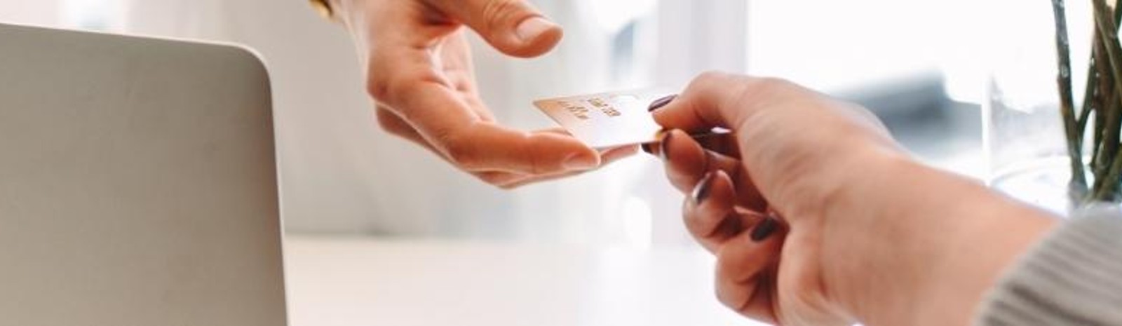 A person paying with a debit card.